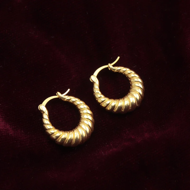 large gemstone earrings for women-Nipura Golden Glowing Twist Hoops