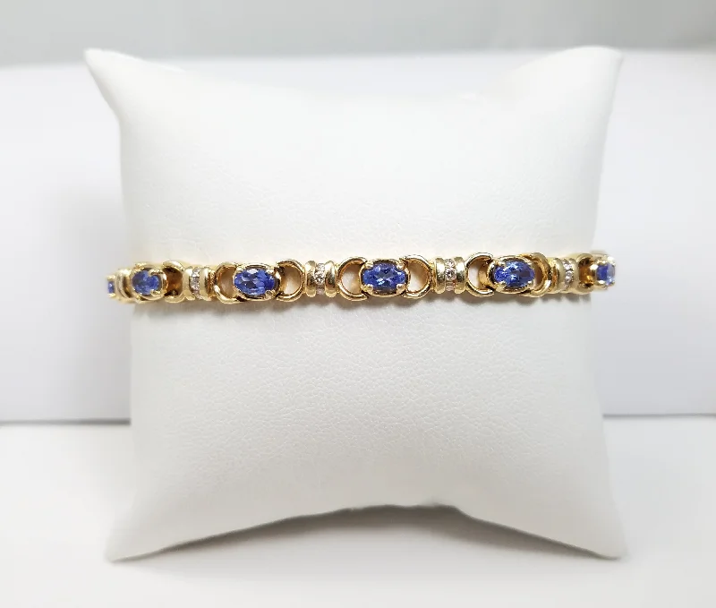 contemporary bangles for women-Elegant 7.25" 14k Yellow Gold Natural Tanzanite Diamond Bracelet